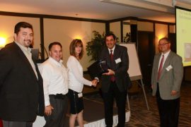 From left are Rob Cerroni, Paul Siciliano and Darlene Kocsis of Heilind being presented by George Peletis, general manager and Daryl Tessman, supply chain manager, both of Parker Hannifin ECD.