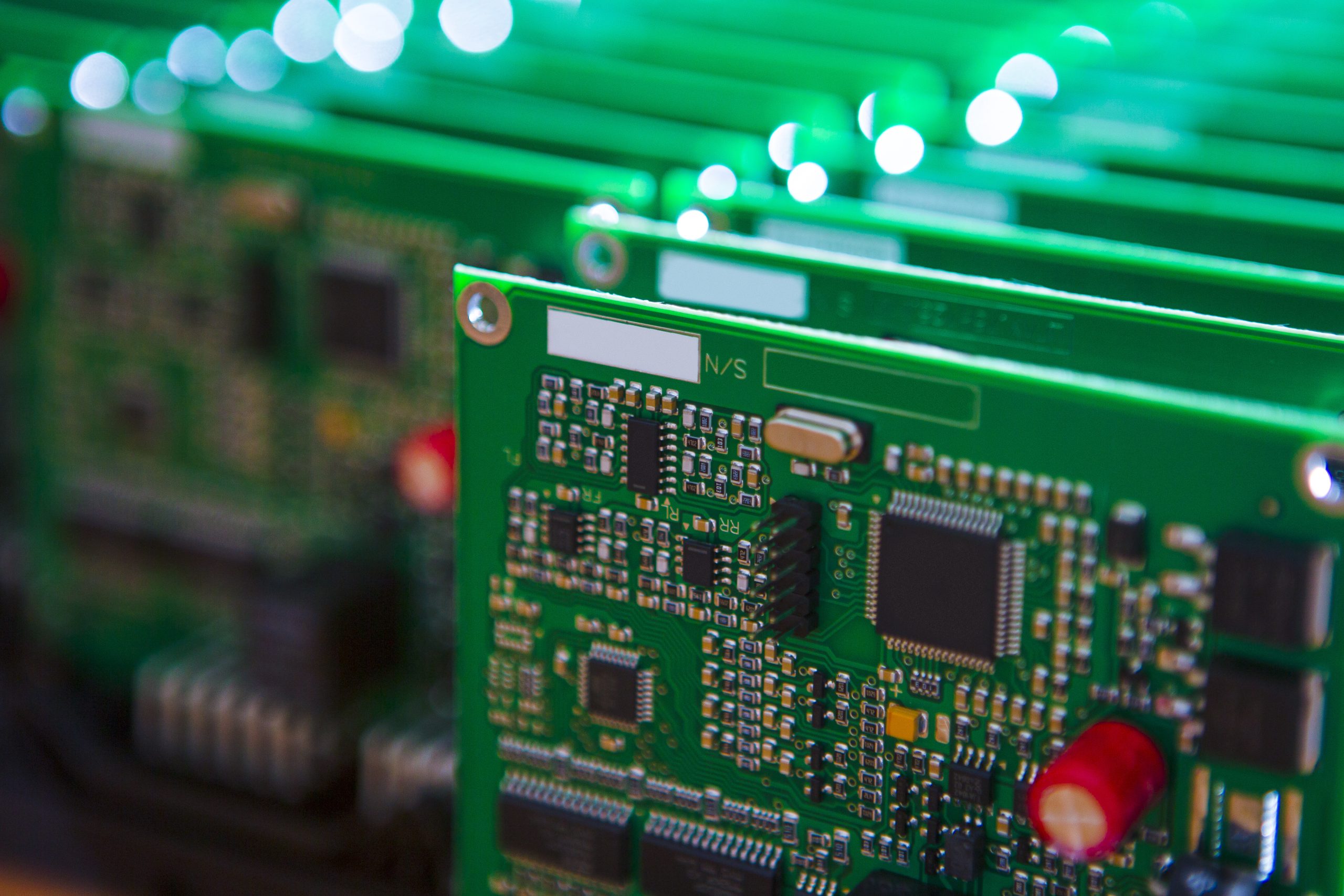Modern Electronics Ideas. Closeup of Lot of Electronic Printed Circuit Boards with Lots of Surface Mounted Components.
